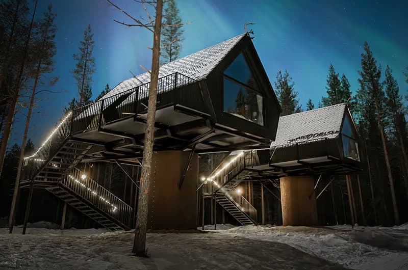 Night view of an Aurora Treehouse at Aito Resort