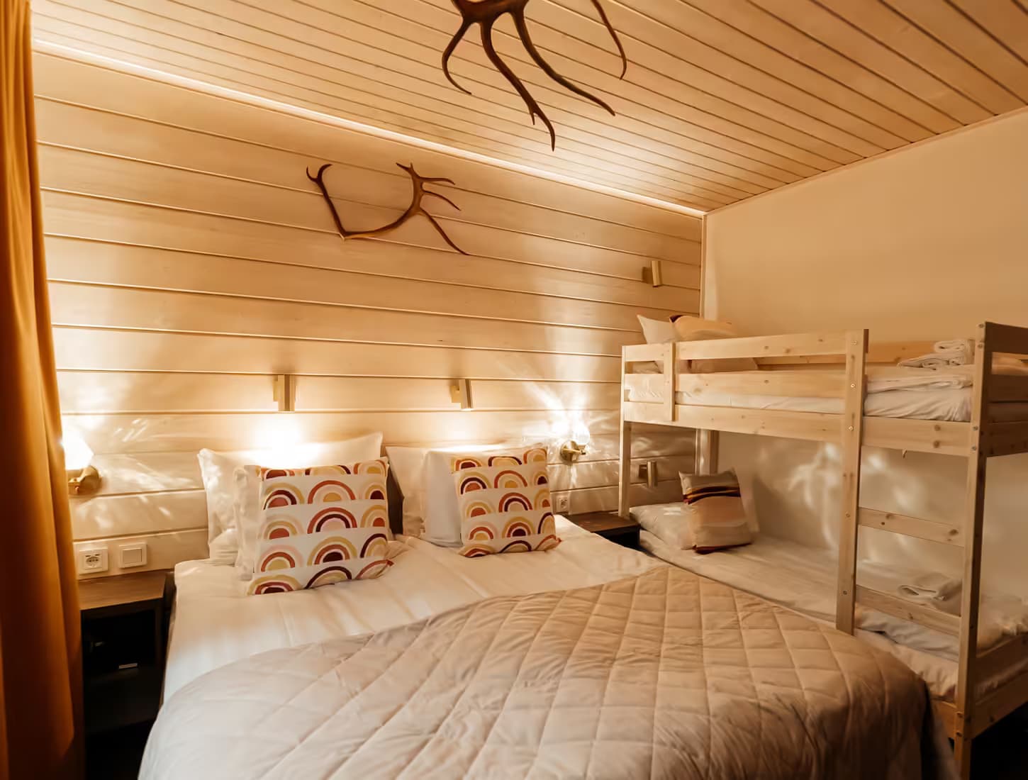 A queen size bed and a bunk bed in a Family room at Aito Resort