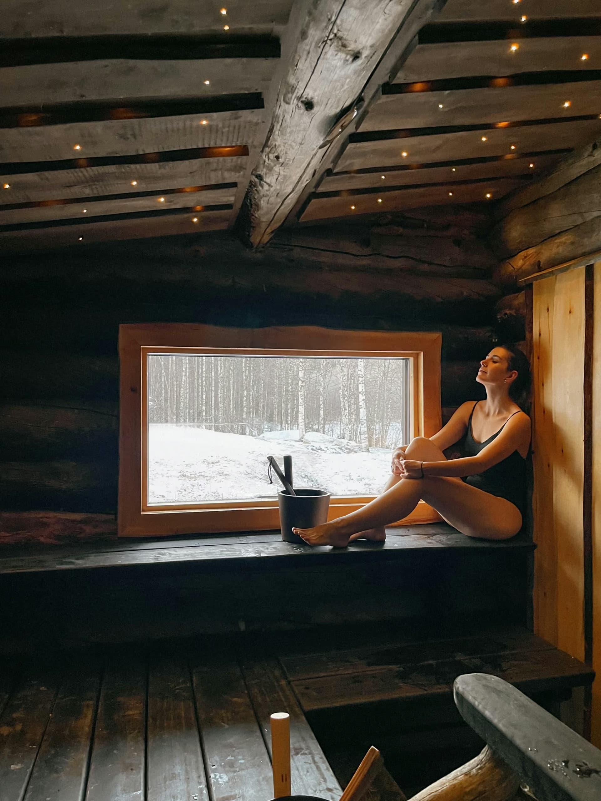 Woman enjoying a sauna at Aito Resort