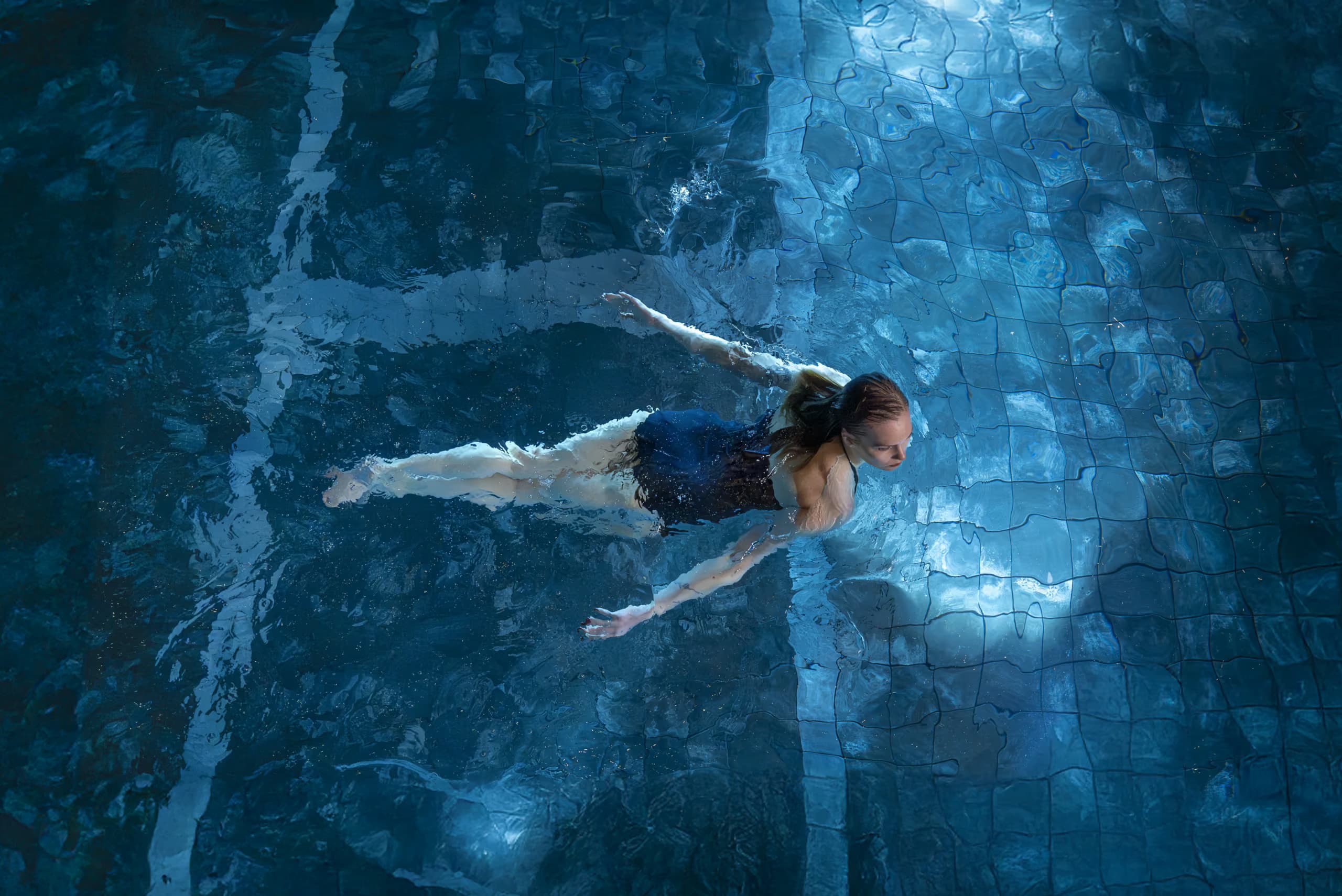 Woman swimming in the vitality pool at Aito Resort