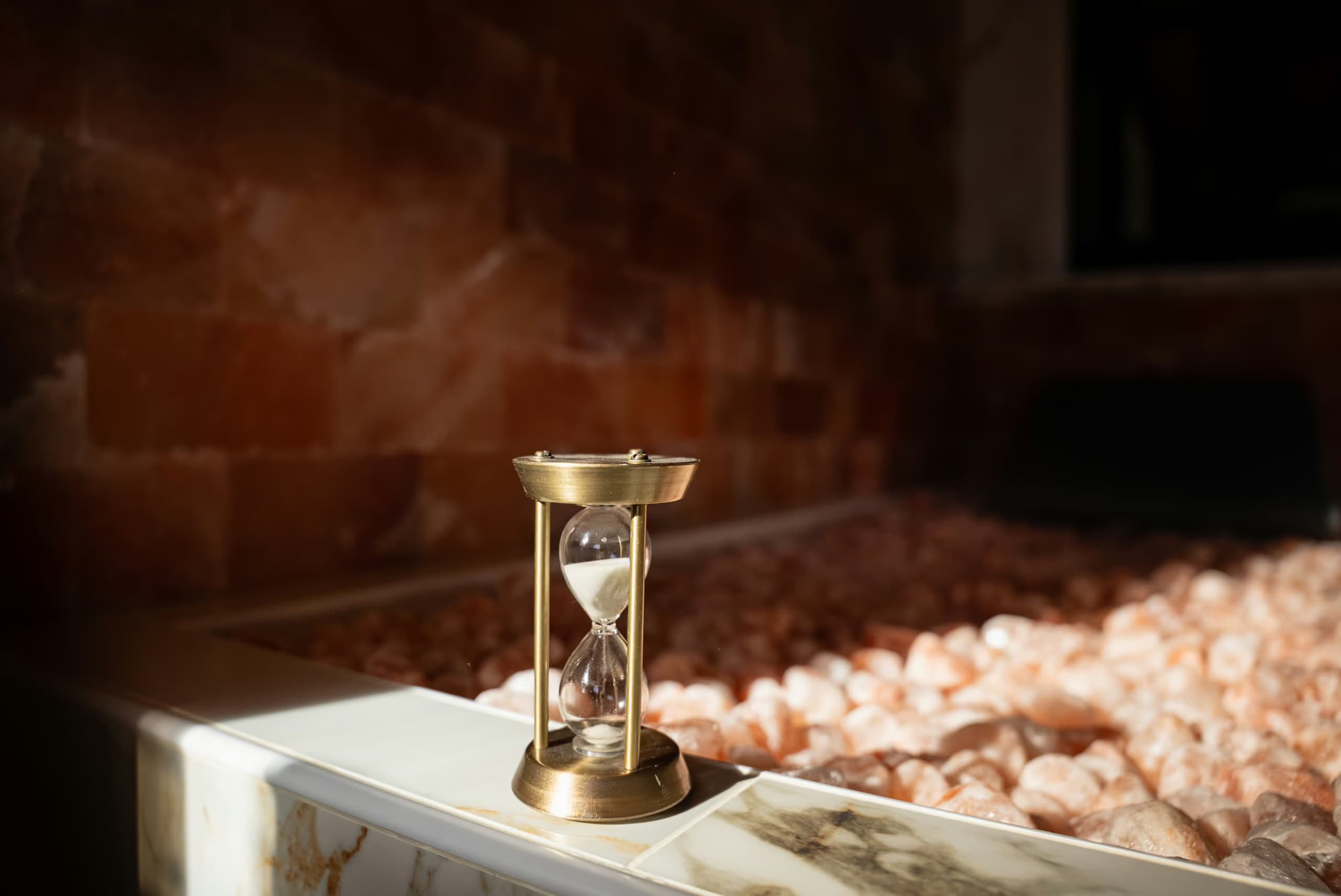 Hourglass near a Himalayan salt bed