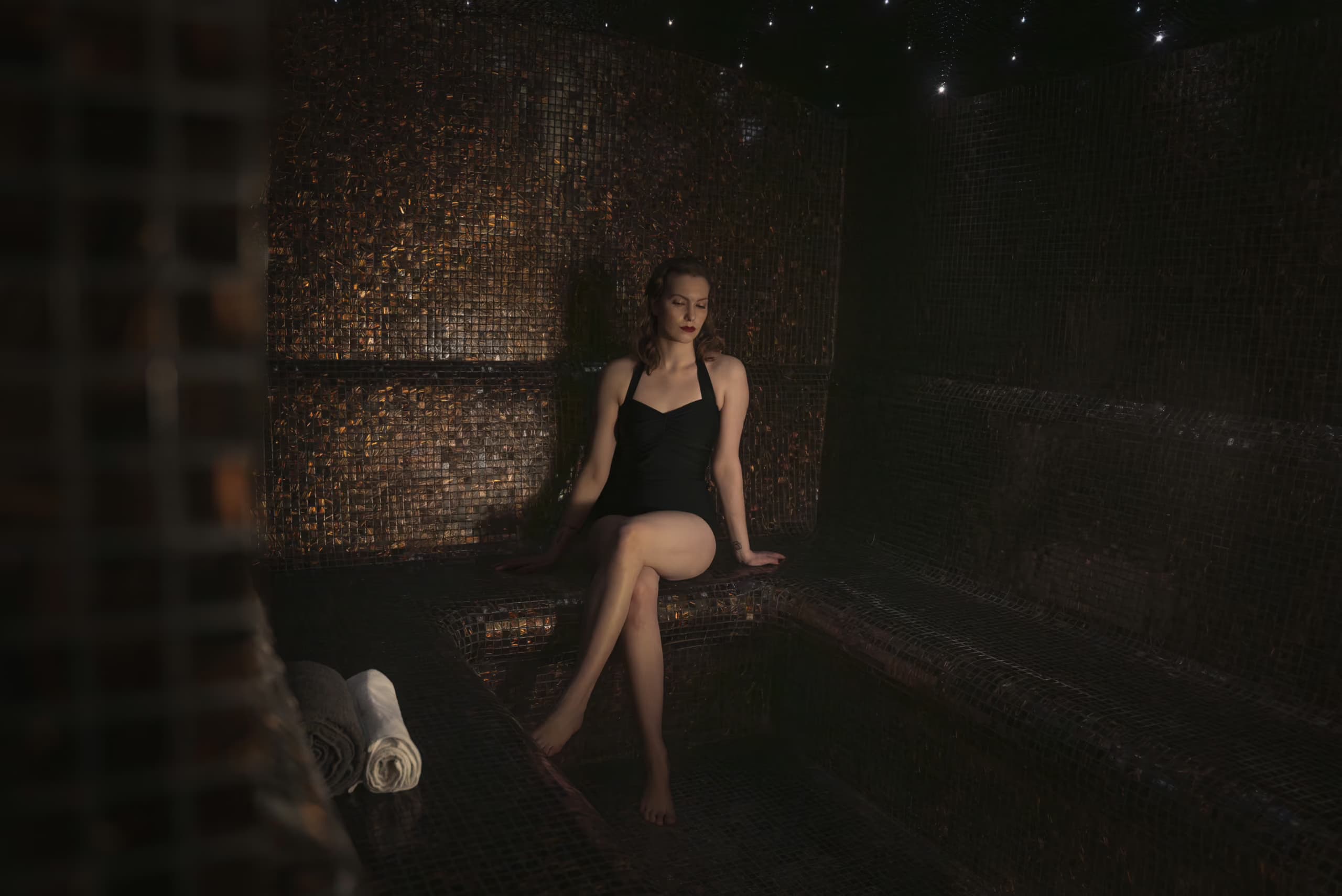 Woman sitting in Aito Resort's steam room