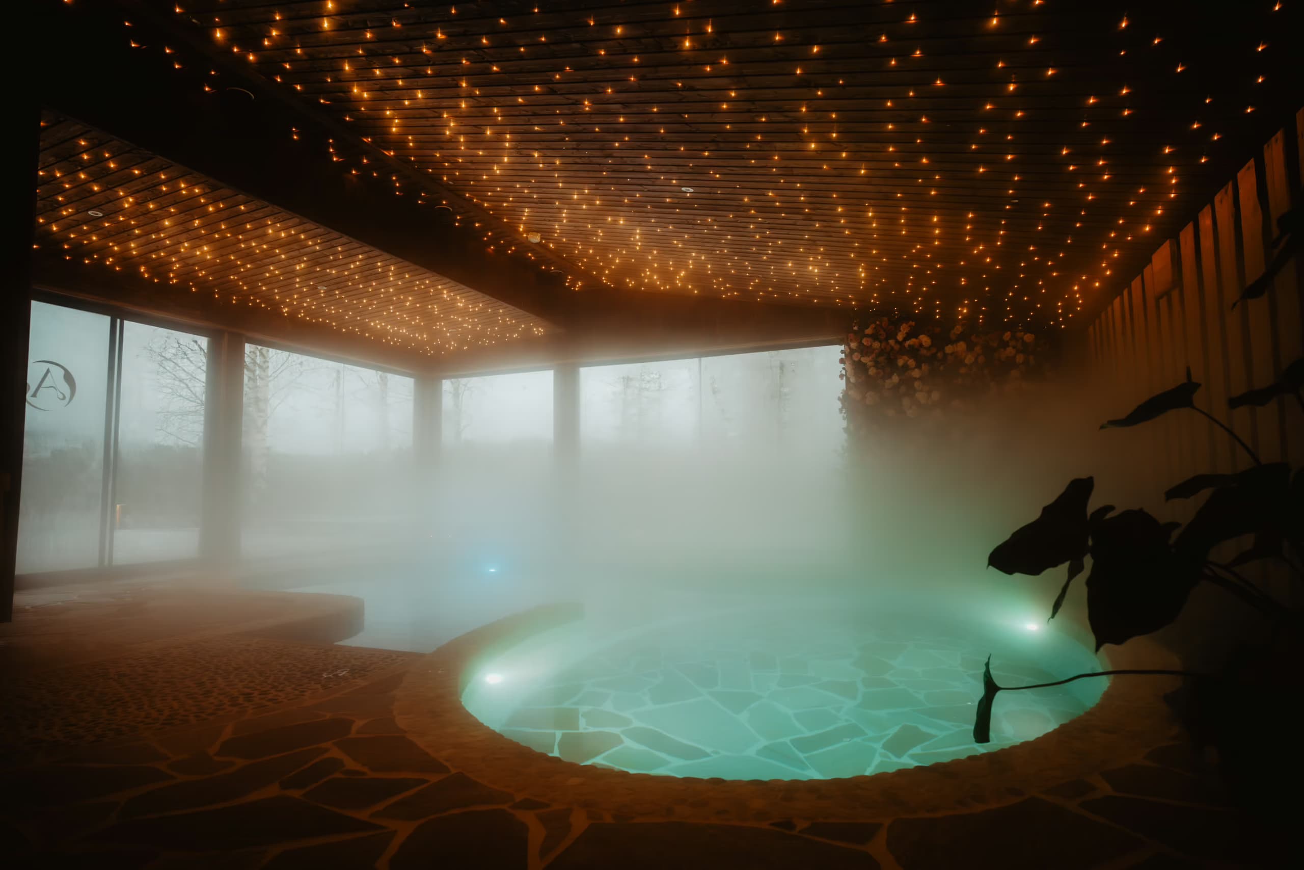 Hot Spring area shroud in mist at Aito Resort's Arctic Spa Centre