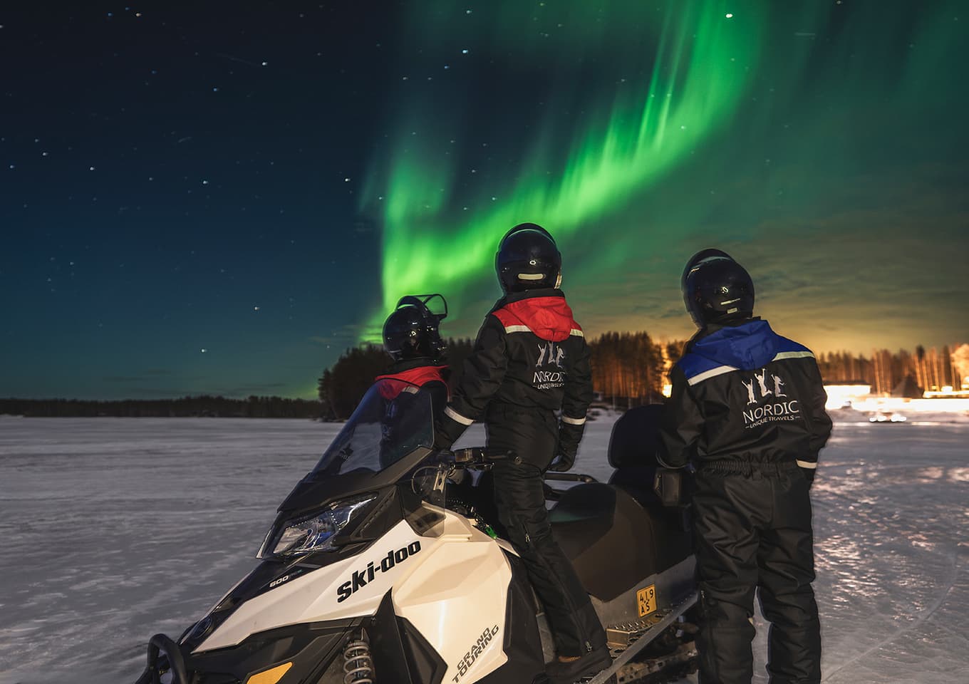Northern lights and snowmobiles