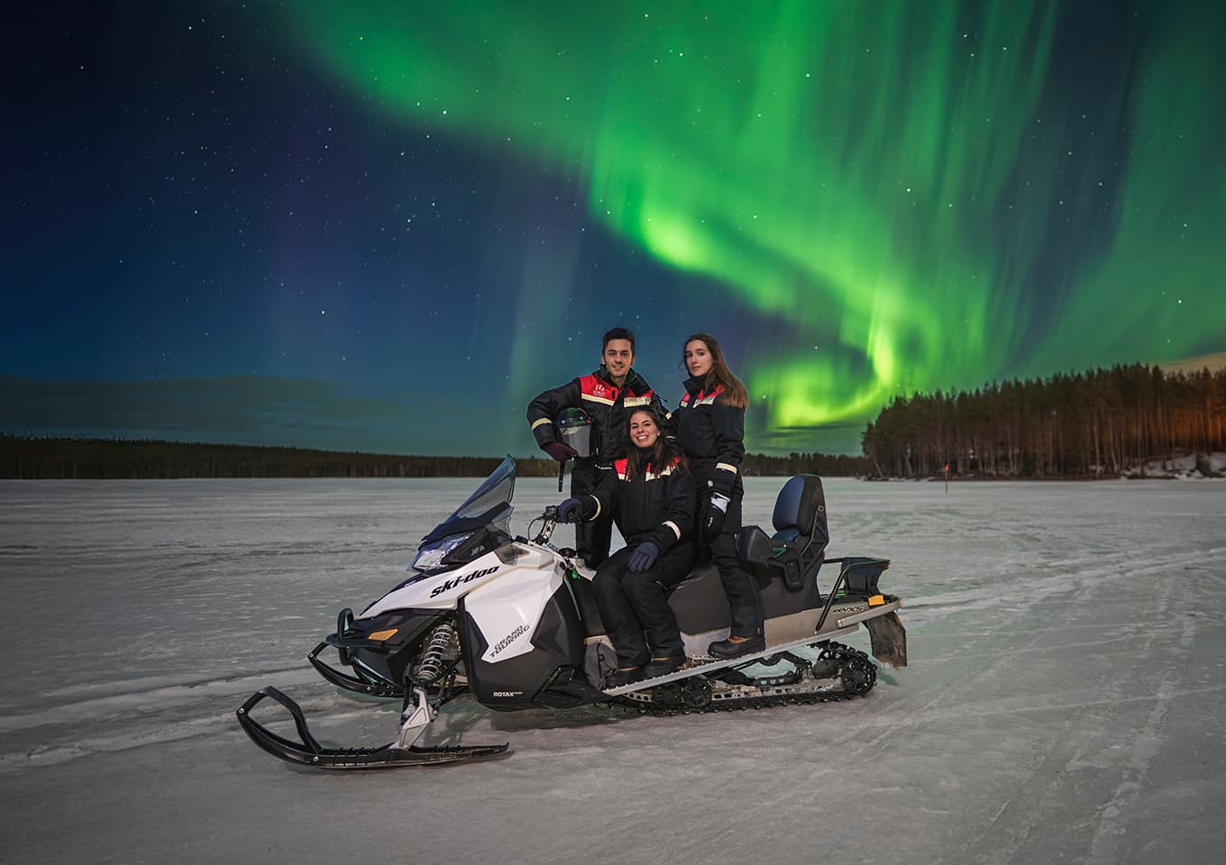 Northern lights and snowmobiles