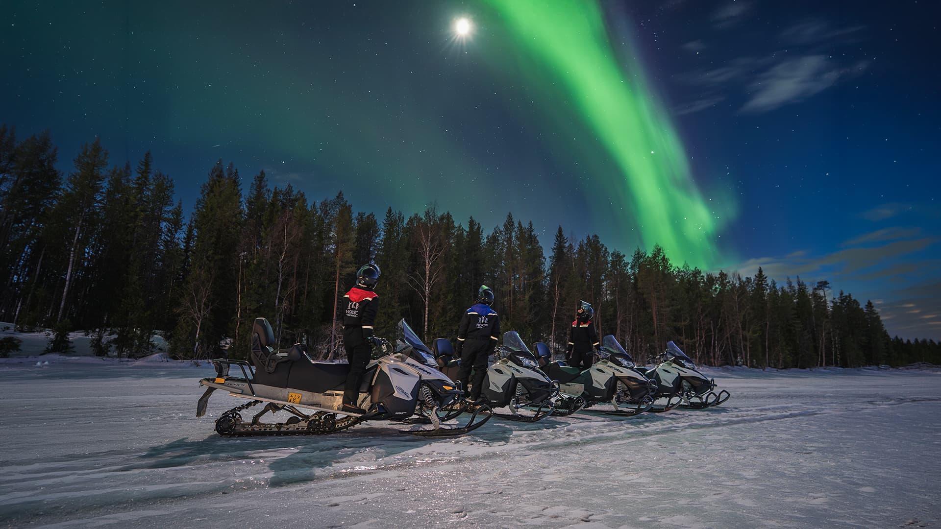 Northern lights and snowmobiles